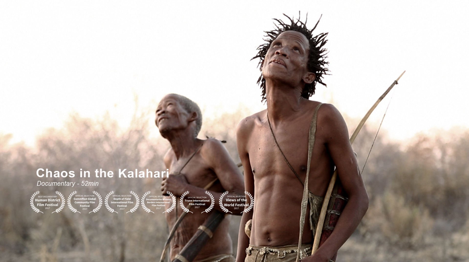 Two people, both with bows and arrows, stand in a dry, grassy landscape. They look upwards with expressions of concentration. One is older and has gray hair, the other is younger and wears a strap across his chest. Text reads: "Chaos in the Kalahari, Documentary - 52min." Several film awards are displayed below.