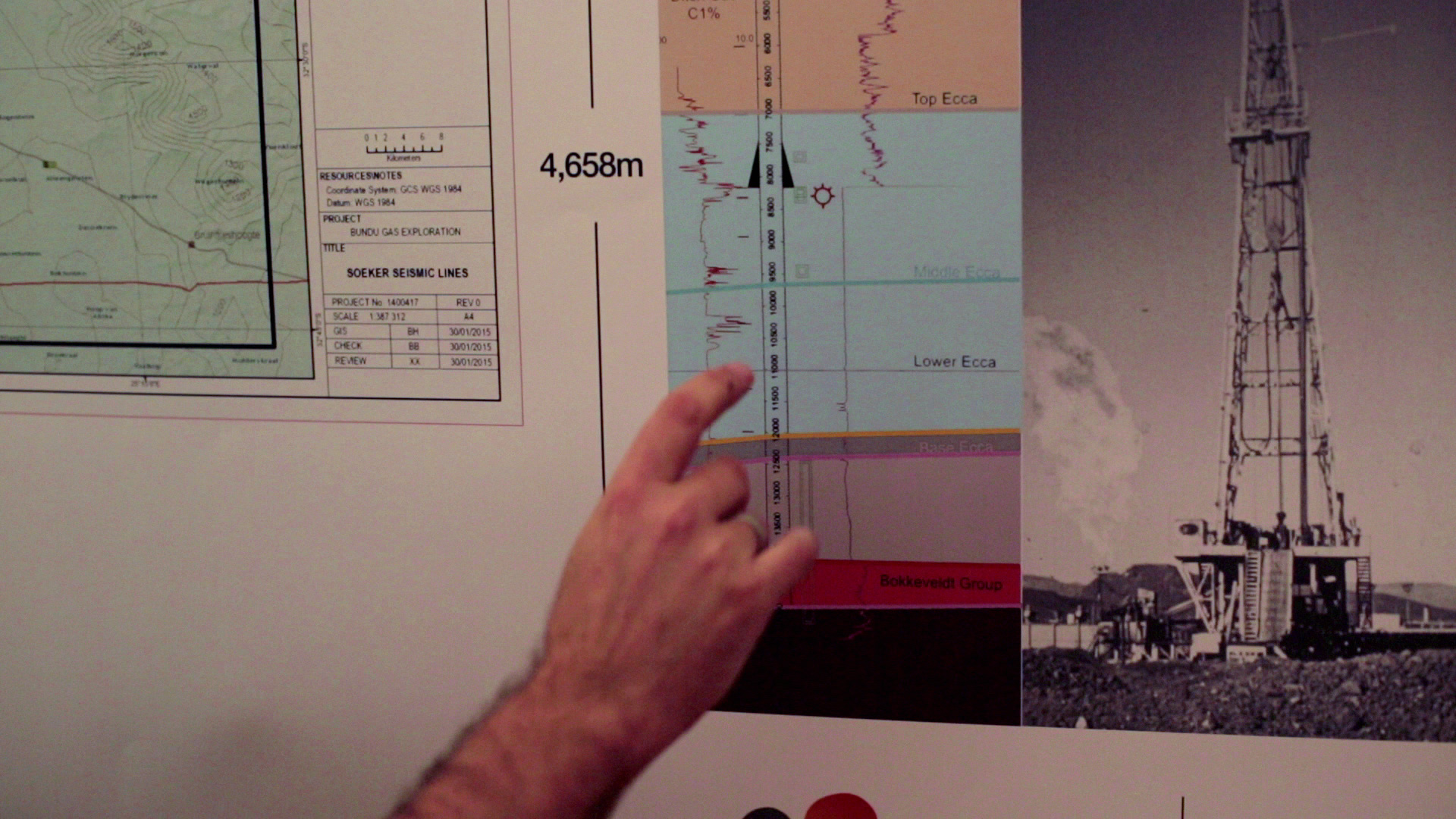 A person's hand points to a detailed drilling report with colorful, labeled geological layers on the right side, a map on the left, and a photograph of a drilling rig at the bottom right. The report indicates a depth of 4,658 meters.